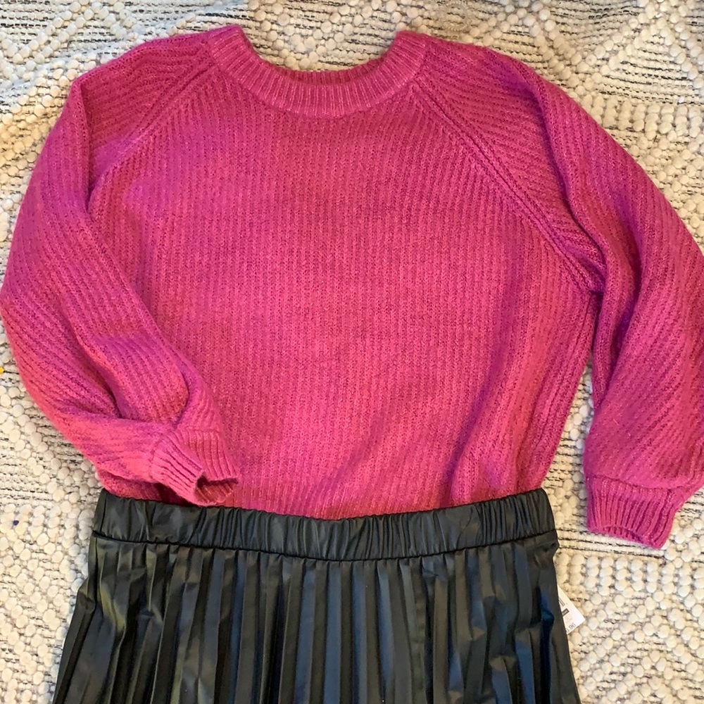 Pink knit sweater with cute cuff detailing